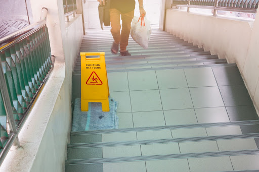 Wet floor sign on a staircase